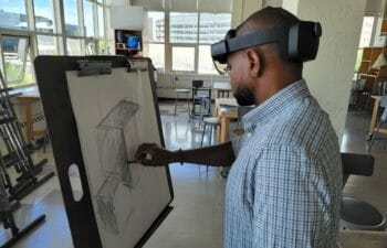 Man using VR while drawing