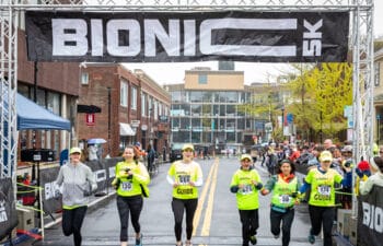 Bionic 5k race competitors cross the finish line.