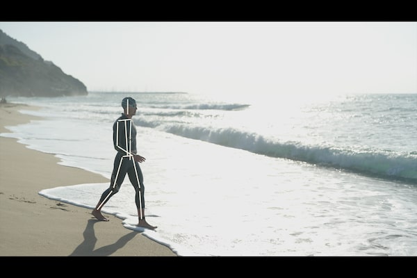 Example image of a man walking on a beach