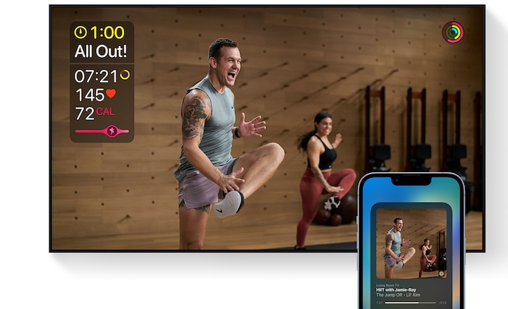 A BRAVIA TV with a smartphone in the foreground, both devices showing the same fitness workout