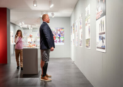 Honorary Chair Brian Lore viewing Bespoke Bodies: The Design & Craft of Prosthetics exhibition panels.