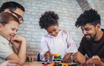 Parents building with their kids.