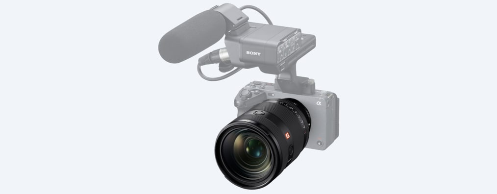 Product image showing the lens mounted on the FX3 body with a microphone attached