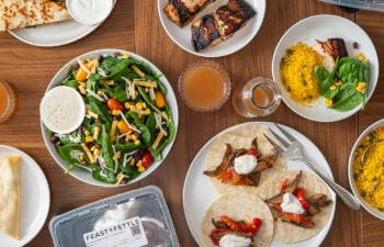 Feast & Fettle meal delivery contents. An array of plated meals displayed on a table.