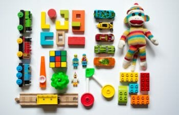 Toys laid out in grid on white background