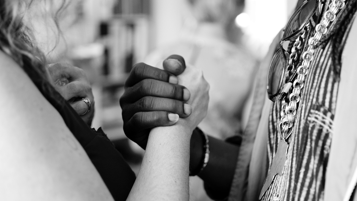 Two people holding hands